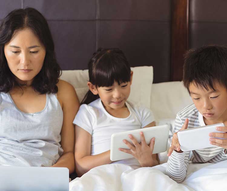 Family using different devices at the same time